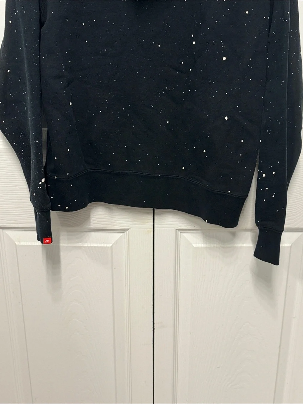 Nike Black Pullover Hoodie with White Swoosh and Paint Speckle